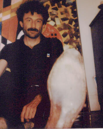 Kingdom of Forgetting portrait Hogan Ellis seated beside a sculptural object during the Kingdom of Forgetting photo session