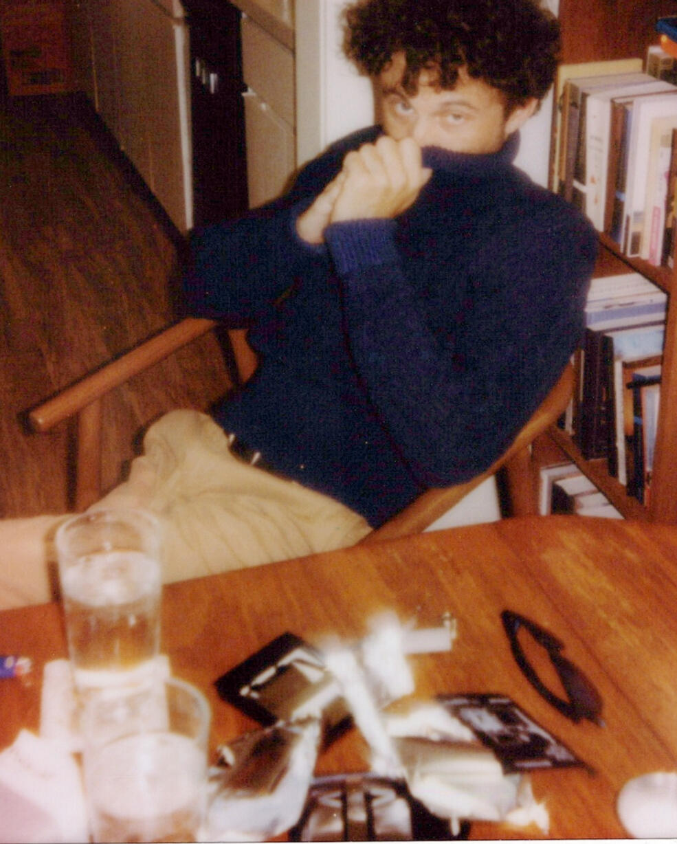 Kingdom of Forgetting Hogan Ellis seated at a table during the Kingdom of Forgetting photo session